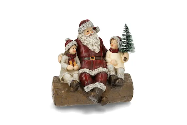 Joulupukki tukin päällä